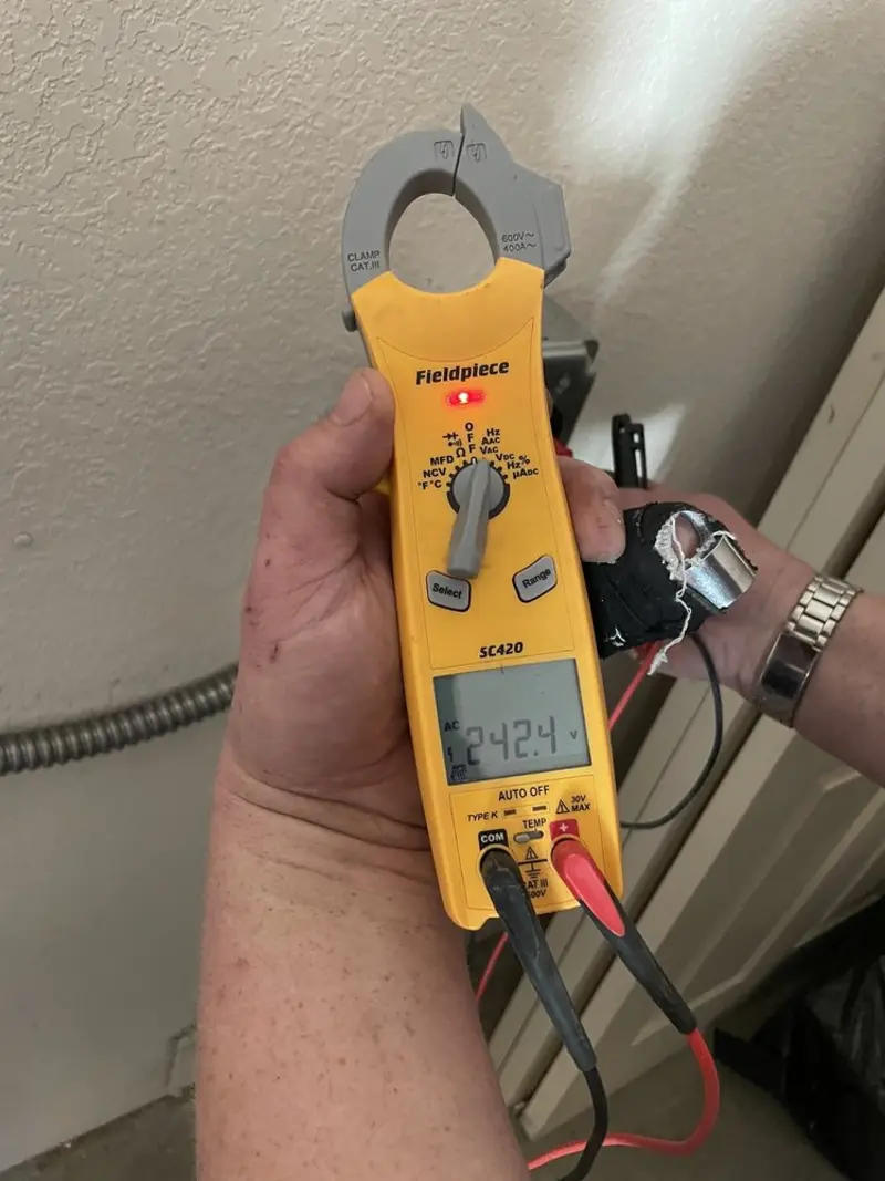Voltage testing with clamp meter during Electrical Installation Services in Auburndale